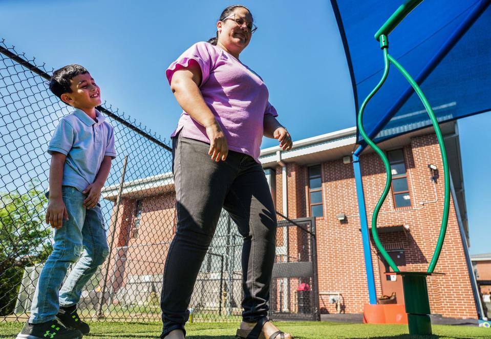 Second grader Nestor Guzman and his mother, Anabel Gutierrez, play together at Valley View Elementary on family involvement day Friday. Gutierrez hopes her son can finish out his elementary school days at Valley View, just as her daughter did, but enrollment numbers are putting that goal in jeopardy.