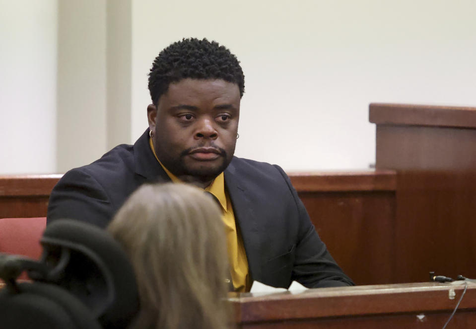 Adarius Carr testifies during the sentencing phase of Aaron Dean's trial at Tarrant County's 396th District Court on Friday, Dec. 16, 2022, in Fort Worth, Texas. Dean, a former Fort Worth police officer, was found guilty of manslaughter in the 2019 shooting death of Carr's sister, Atatiana Jefferson. (Amanda McCoy/Star-Telegram via AP, Pool)