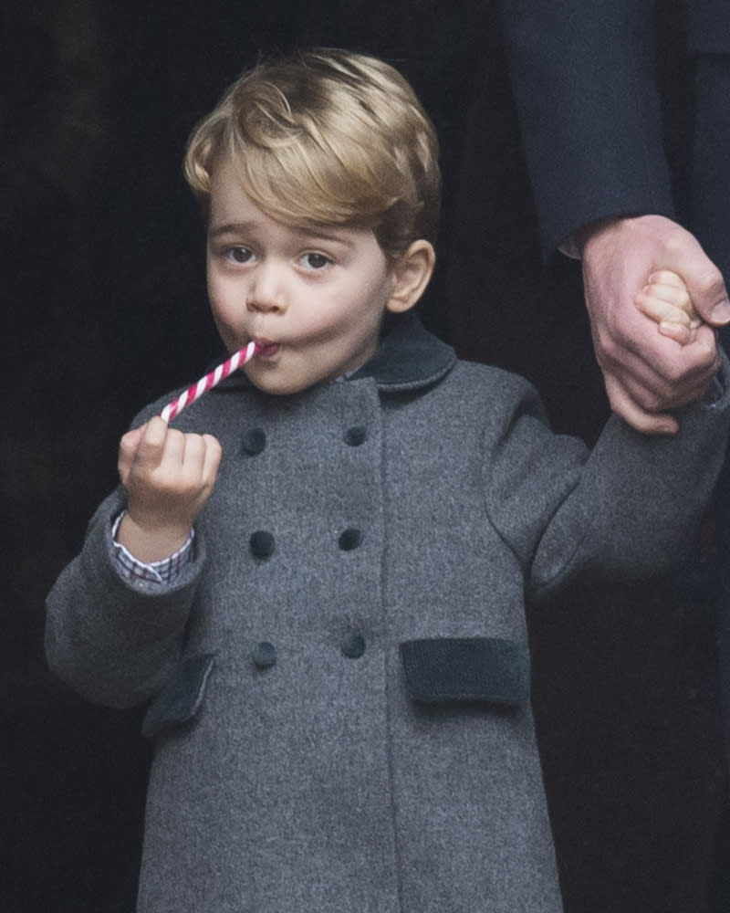 7. Prince George tucks into a candy cane
