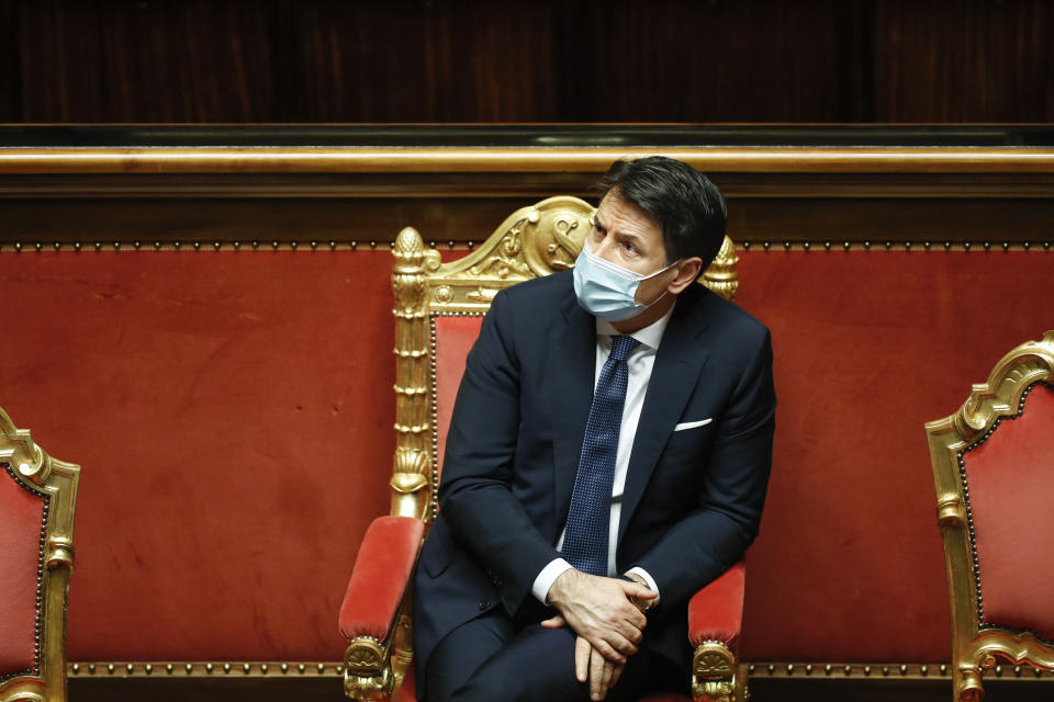 Italian Prime Minister Giuseppe Conte attends the debate at the Senate prior to a confidence vote, in Rome, Tuesday, Jan. 19, 2021. Italian Premier Giuseppe Conte fights for his political life with an address aimed at shoring up support for his government, which has come under fire from former Premier Matteo Renzi's tiny but key Italia Viva (Italy Alive) party over plans to relaunch the pandemic-ravaged economy. (Yara Nardi/pool photo via AP)
