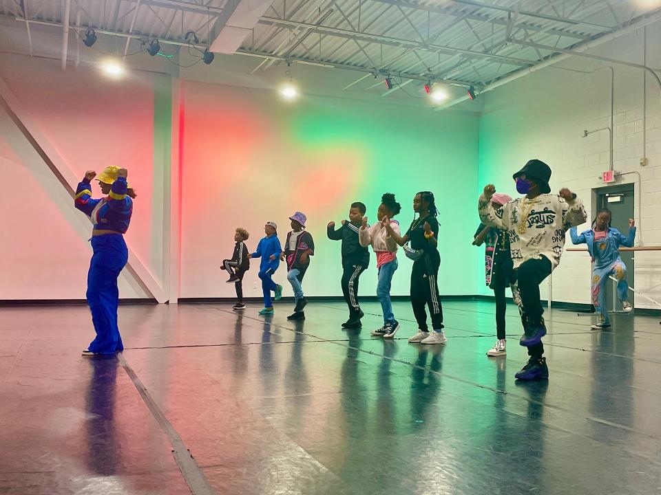 Motor City Dance Factory instructor Jade Hatchet leads 13 kids from the Oakland County Chapter of Jack and Jill of America, Inc. in a hip-hop dance.