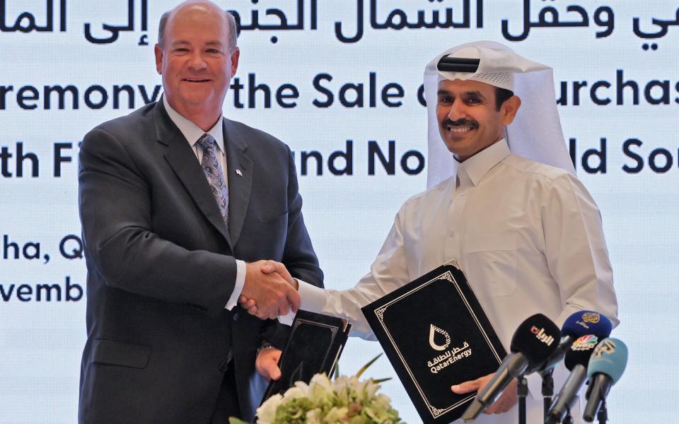 Saad Sherida al-Kaabi, Qatar's energy minister and CEO of QatarEnergy, and Ryan Lance, CEO of multinational corporation ConocoPhillips - KARIM JAAFAR/AFP