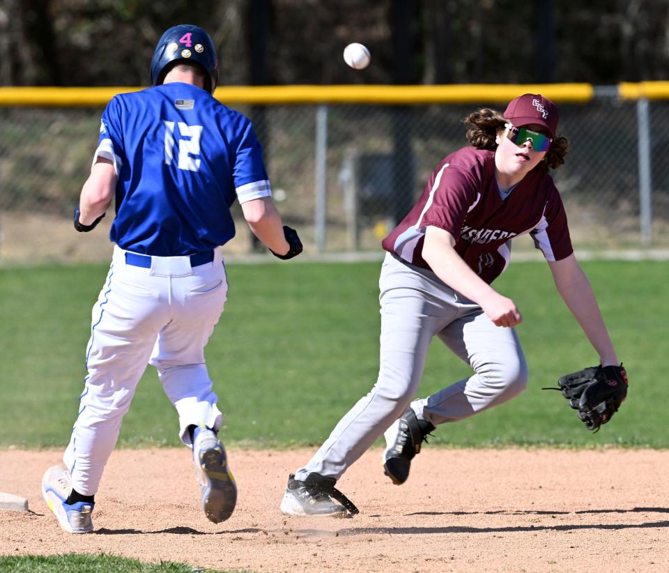 Tyler Kutil of Upper Cape Tech arrives at second as Nolan Baker of Cape Tech watches the throw.