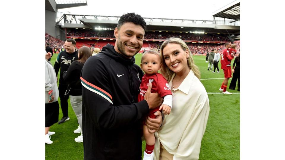 Alex, perrie and axel posing for a photo after a football game