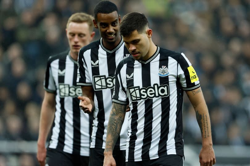 Bruno Guimaraes of Newcastle United and Alexander Isak of Newcastle United on the pitch during the Premier League match between Newcastle United and Everton FC at St. James Park on April 2, 2024 in Newcastle upon Tyne, England.