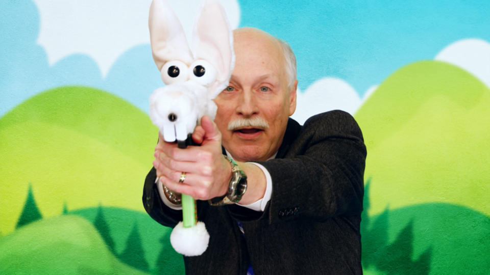 Gun rights advocate Philip Van Cleave participating in an fictional ad campaign for stuffed animal guns for children in the premiere of "Who Is America?" (Photo: Showtime)
