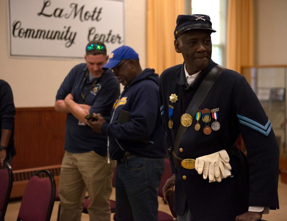 A Civil War reenactor stands to leave after La Mott residents led a panel discussion with several state representatives, discussing local history and the hope to restore La Mott Community Center in Cheltenham Township, Pennsylvania, on May 9, 2023. The center and community staple for many has been closed for nearly three years, and the township hopes to secure a federal grant to save it.