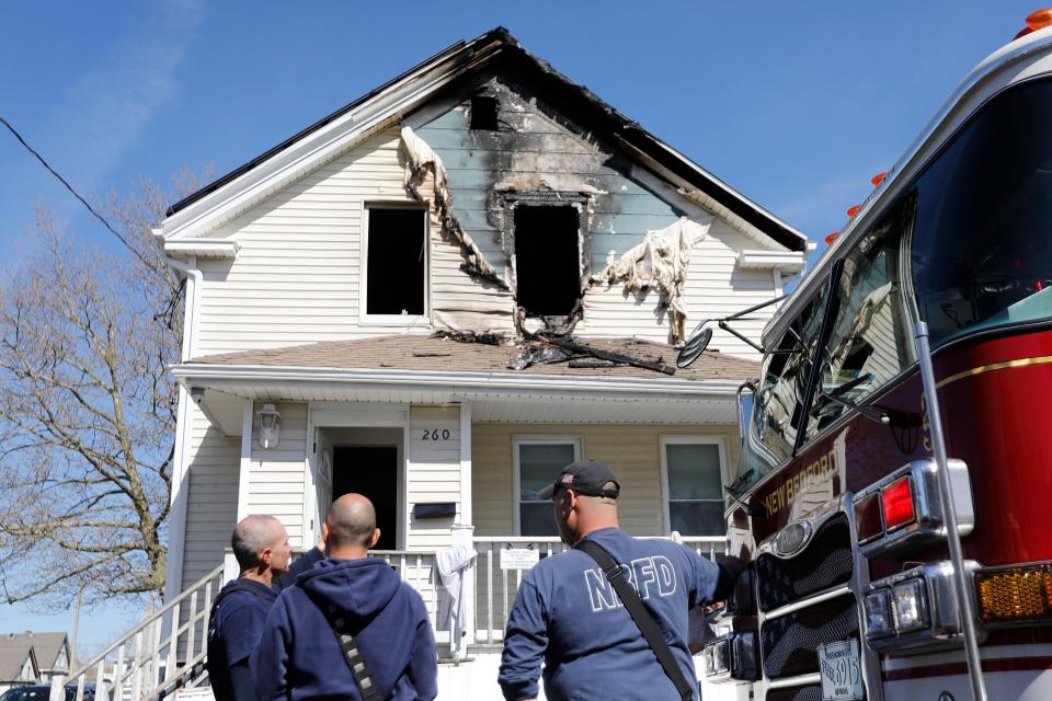 New Bedford fire respond to a fire on the second floor of a single family residence at 260 Chestnut Street Thursday. Four people were removed from the building and taken to St. Luke's Hospital. Fire officials confirm one of the residents has died.