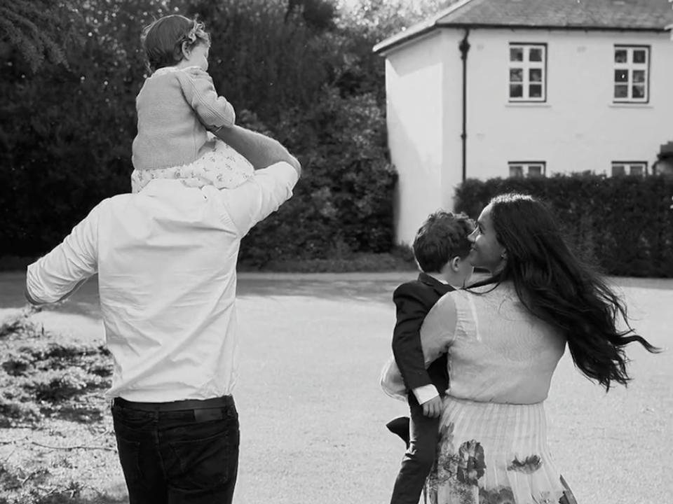 Prince Harry, Meghan Markle, Lilibet, and Archie walk together.