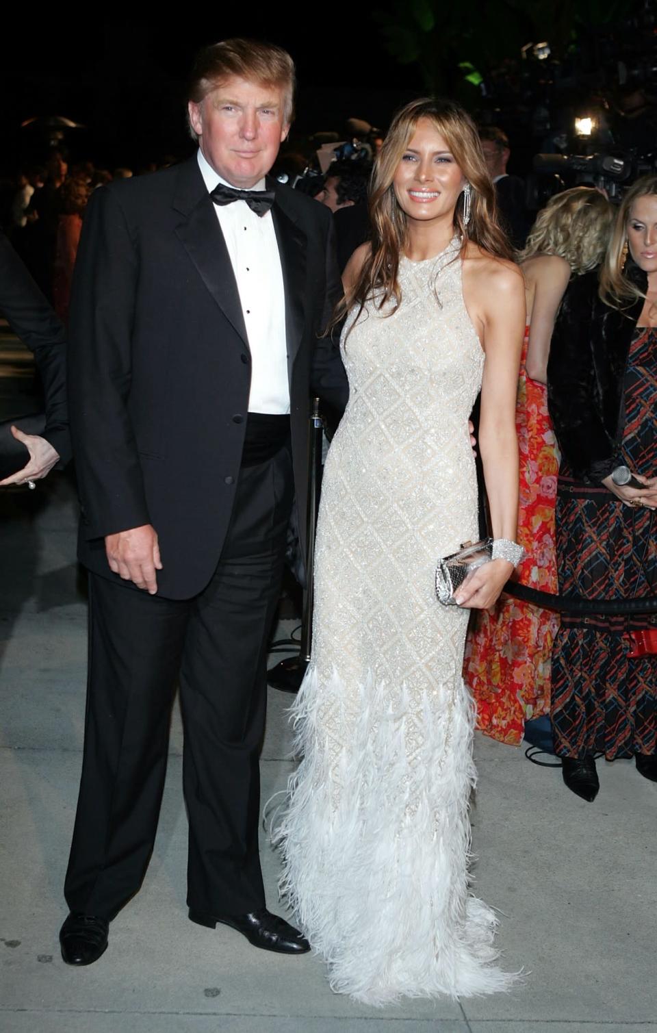 <p>For Elton John's annual Aids Ball, Melania and Donald rocked up in the perfect evening attire with the First Lady wearing a feathered silvery gown. <i>[Photo: Getty]</i> </p>