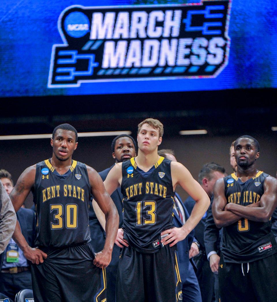 Kent State's Deon Edwin, left, Mitch Peterson, center, and Jalen Avery, right, watch the closing moments of the team's first-round game against UCLA in the NCAA Tournament in Sacramento, Calif., Friday, March 17, 2017. UCLA won 97-80.