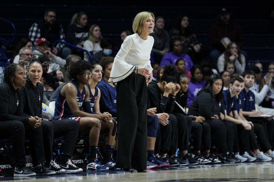 UConn associate head coach Chris Dailey stands next to the bench during the first half of an NCAA college basketball game against Xavier, Thursday, Jan. 5, 2023, in Cincinnati. (AP Photo/Jeff Dean)