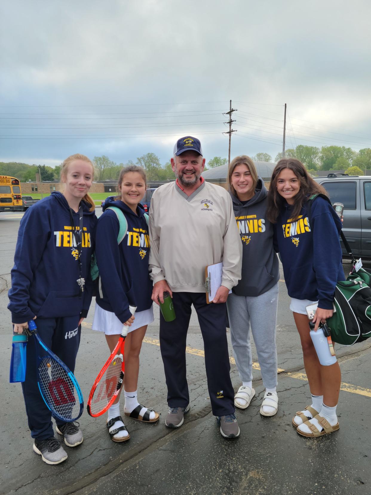 Hillsdale Hornet head coach Scott Phillips and hornet tennis players.