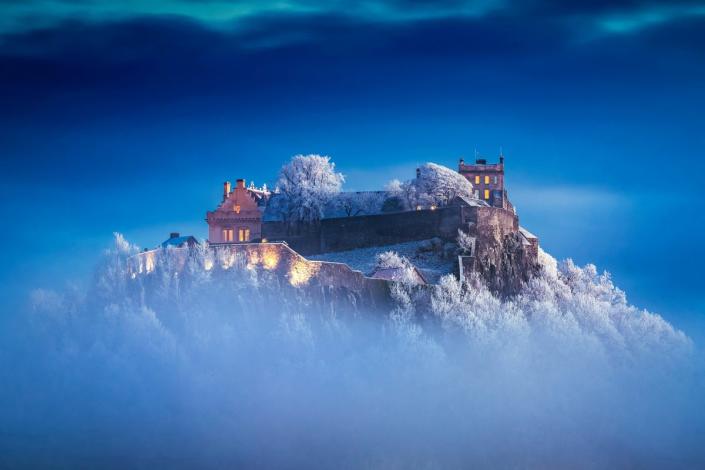 A photographer snapped snow-capped Stirling Castle shrouded in mist as he compared it to something out of Harry Potter (Brian Smith/SWNS)