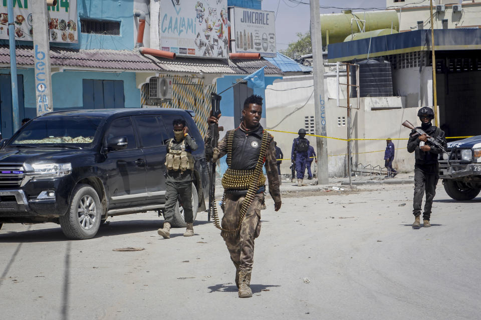 FILE - Security forces patrol at the scene, after gunmen stormed the Hayat Hotel in the capital Mogadishu, Somalia on Aug. 21, 2022. The deadly siege was the longest such attack in the country's history taking more than 30 hours for security forces to subdue the extremists, with more than 20 people killed. (AP Photo/Farah Abdi Warsameh, File)