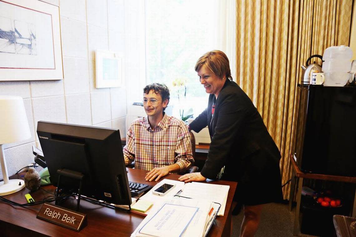 Rep. Mary Belk, right, talks with her son and legislative assistant, Ralph Belk III, in her office at the N.C. Legislature on Thursday, May 4, 2017.