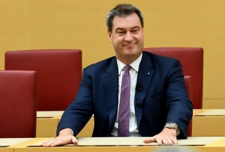 Markus Soeder of the Christian Social Union (CSU) takes his seat after he was sworn in as new Bavarian State Prime Minister in Munich, Germany, November 6, 2018. REUTERS/Andreas Gebert