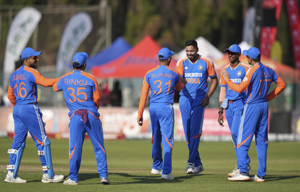 Indian players are seen on the pitch during the T20 cricket between Zimbabwe and India at Harare Sports club,Sunday, July 7,2024.(AP Photo/Tsvangirayi Mukwazhi)