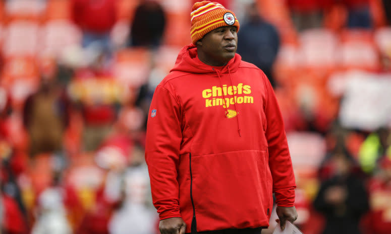 Eric Bieniemy watches pregame warmups.