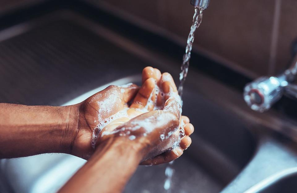 Not washing your hands after touching raw meat