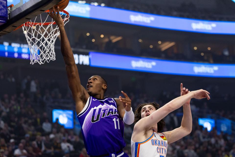Utah Jazz guard <a class="link " href="https://sports.yahoo.com/nba/players/5636/" data-i13n="sec:content-canvas;subsec:anchor_text;elm:context_link" data-ylk="slk:Kris Dunn;sec:content-canvas;subsec:anchor_text;elm:context_link;itc:0">Kris Dunn</a> (11) shoots the ball with Oklahoma City Thunder guard Josh Giddey (3) on defense during an NBA basketball game between the Utah Jazz and the Oklahoma City Thunder at the Delta Center in Salt Lake City on Tuesday, Feb. 6, 2024. | Megan Nielsen, Deseret News
