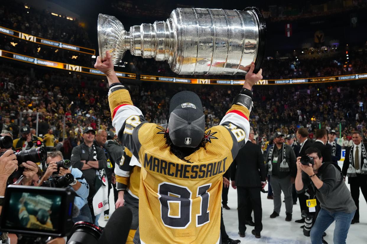 Jun 13, 2023; Las Vegas, Nevada, USA; Vegas Golden Knights forward Jonathan Marchessault (81) hoists the Stanley Cup after defeating the Florida Panthers in game five of the 2023 Stanley Cup Final at T-Mobile Arena. Mandatory Credit: Stephen R. Sylvanie-USA TODAY Sports