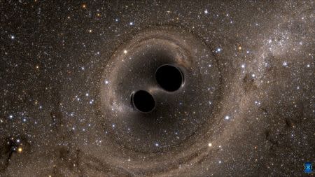 The collision of two black holes holes - a tremendously powerful event detected for the first time ever by the Laser Interferometer Gravitational-Wave Observatory, or LIGO - is seen in this still image from a computer simulation released in Washington February 11, 2016. REUTERS/Caltech/MIT/LIGO Laboratory/Handout via Reuters/Files