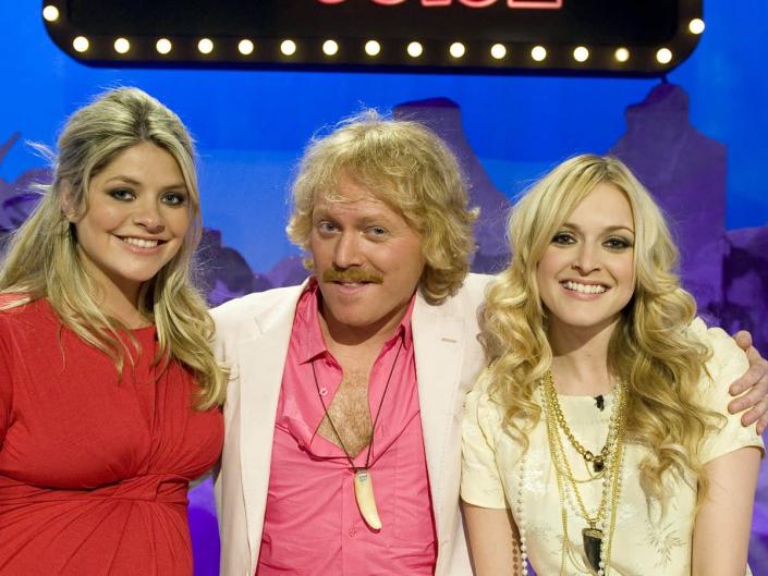 Leigh Francis as Keith Lemon (centre), alongside past ‘Celebrity Juice’ team captains Holly Willoughby (left) and Fearne Cotton (right) (ITV/Shutterstock)