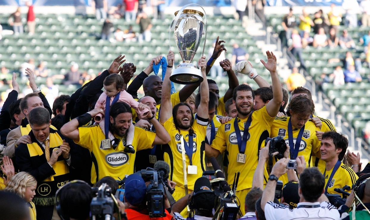 The Crew's Frankie Hejduk holds up the MLS Cup trophy after their 3-1 win over the New York Red Bulls in 2008.