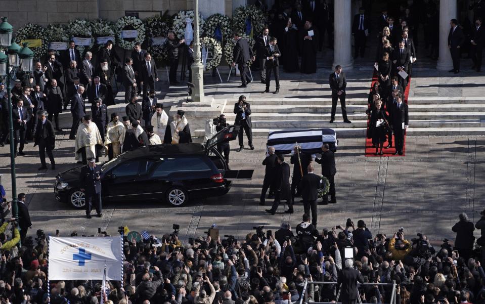 The coffin of former king Constantine II of Greece is carried out of Saint Eleftherios cathedral and loaded onto a hearse after the funeral service - Getty Images Europe