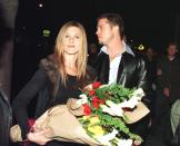 <p>Brad and Jennifer Aniston <a href="https://www.eonline.com/news/1013930/the-truth-about-brad-pitt-and-jennifer-aniston-s-current-relationship" rel="nofollow noopener" target="_blank" data-ylk="slk:reportedly;elm:context_link;itc:0;sec:content-canvas" class="link ">reportedly</a> met after Brad had their agents set them up on a date in 1998. Here they are leaving Los Angeles' Barfly nightclub, where he threw her a massive 30th birthday party in February 1999.</p>