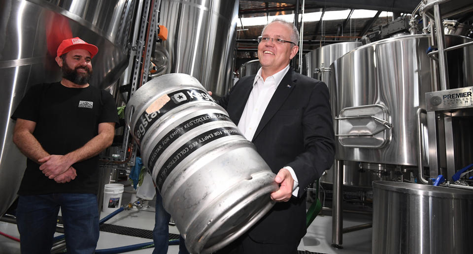 Australian Treasurer Scott Morrison lifts a keg during a visit to Capital Brewing Co in Canberra. Small batch brewers are set to be a big winner from tonight’s budget. Source: AAP