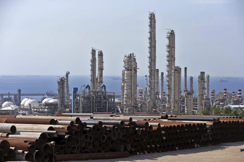 FILE-- This Nov. 19, 2015 file photo shows a general view of a petrochemical complex in the South Pars gas field in Asaluyeh, Iran, on the northern coast of Persian Gulf. When it comes to saving Iran's nuclear deal, Europe finds itself in the impossible situation of trying to salvage an accord unraveling because of the maximalist U.S. sanctions campaign. (AP Photo/Ebrahim Noroozi, File)