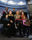 <p>Setting a series aboard a shared space station, as opposed to a Federation vessel, allowed <em>Deep Space Nine </em>to expand on the franchise’s character and costume profile. The darker Starfleet jumpsuits reflect the show’s own darker, more complex storytelling, and the prominent ppresenceof Bajoran and Ferengi fashions in the frame speaks to the mix of cultures that inhabit this deep space outpost.<br><br>(Photo: CBS) </p>