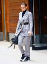 <p>The model wore a suit, cinched with a Chanel belt out and about in New York.</p>