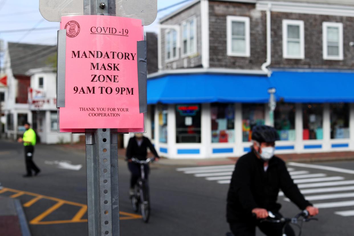 People bike down Commercial Street on May 25, 2020 in Provincetown, Massachusetts (Getty Images)