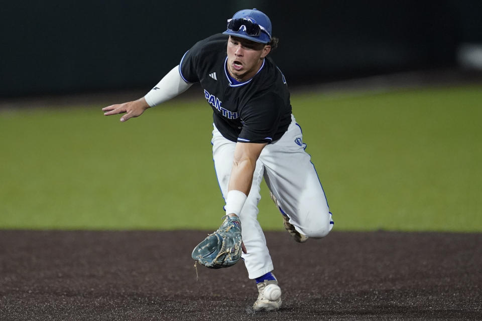 Eastern Illinois shortstop Chris Worcester can't field a Vanderbilt grounder during the eighth inning of an NCAA college baseball tournament regional game Friday, June 2, 2023, in Nashville, Tenn. Vanderbilt won 12-2. (AP Photo/George Walker IV)