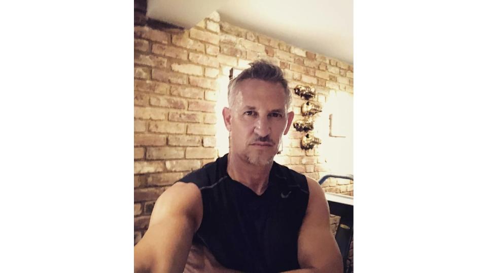 Gary Lineker in a sports top in front of an exposed brick wall