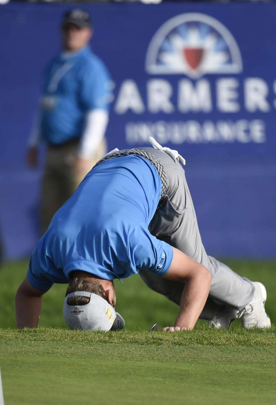 Sebastian Cappelen of Denmark reacts after missing chip shot on the 15th hole of the South Course at Torrey Pines Golf Course during the third round of the Farmers Insurance golf tournament Saturday Jan. 25, 2020, in San Diego. (AP Photo/Denis Poroy)