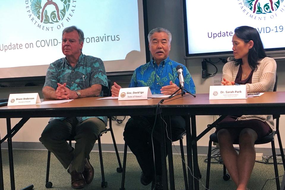 Hawaii Gov. David Ige, center, state Health Director Bruce Anderson, left, and state epidemiologist Sarah Park, said they are focusing their efforts on Oahu since that is where the man began to exhibit symptoms.