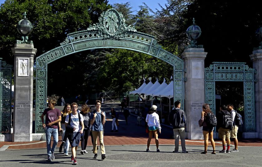 Students walk past Sather Gate on the University of California, Berkeley campus in Berkeley, Calif.
