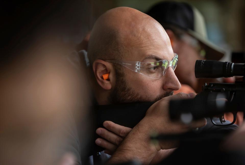 Ahmad Mohammadieh prepares to shoot a target during a Hunter Safety Field Day at the Washtenaw Sportsman's Club in Ypsilanti on Saturday, Sept. 9, 2023.