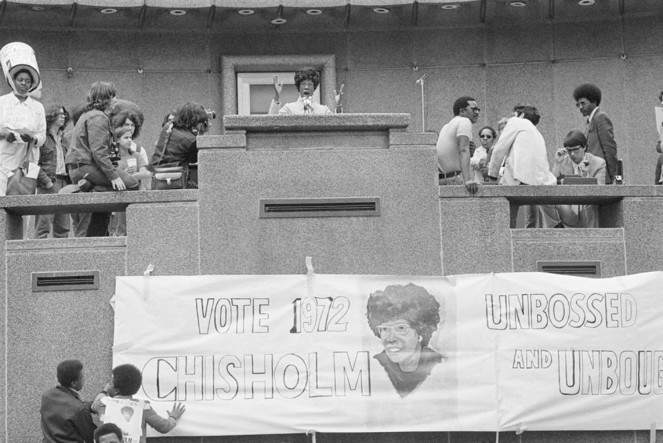 <p>Chisholm spoke out against the Vietnam War during a rally in Detroit. Her presidential campaign slogan, "Unbossed and Unbought" was written on a sign below her podium. </p>