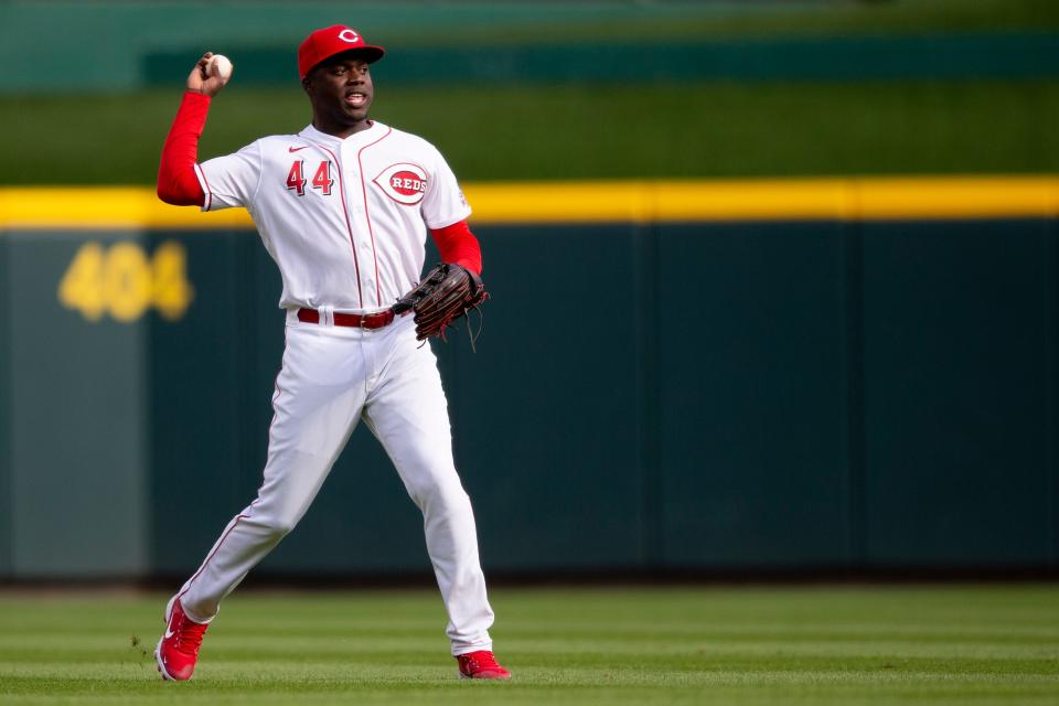 Cincinnati Reds right fielder Aristides Aquino (44) throws the ball in after a base hit by Cleveland Guardians center fielder Steven Kwan (38) in the fifth inning of the MLB interleague game between the Cincinnati Reds and the Cleveland Guardians at Great American Ball Park in Cincinnati, Tuesday, April 12, 2022. 