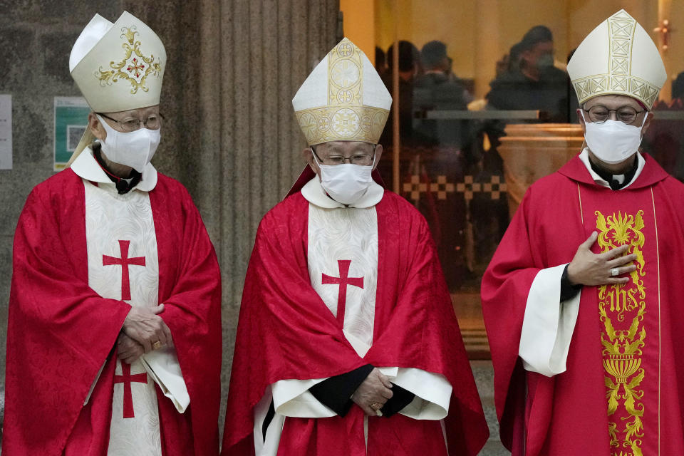 Retired archbishop of Hong Kong Joseph Zen, center, attends the episcopal ordination ceremony of Bishop Stephen Chow, in Hong Kong, Saturday, Dec. 4, 2021. Zen, the 90-year-old Catholic cleric arrested by Hong Kong police on national security charges, has long been a fiery critic of Beijing, along with efforts by the Vatican to reach a working arrangement with the ruling Communist Party. (AP Photo/Kin Cheung)