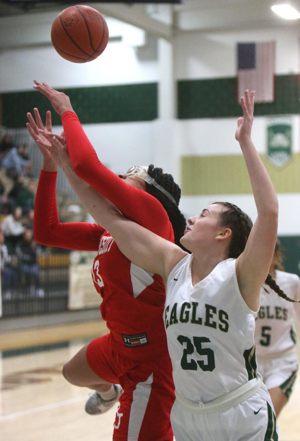 Sophie Smith, 25, of GlenOak fights for a rebound with Hana Belibi, left, of Regis Jesuit during their game at GlenOak on Friday.