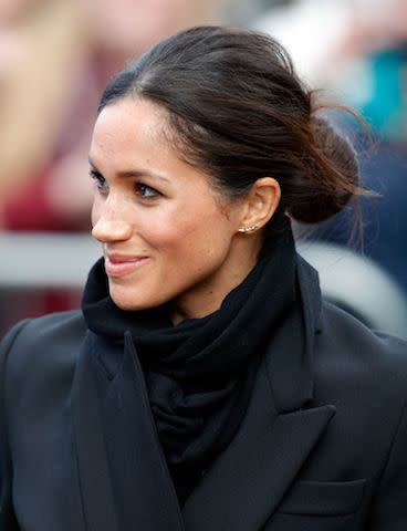 <p>For her first trip to Cardiff, Meghan graced the headlines once more thanks to her royal protocol-breaking bun. But this time, she slicked back any stray wisps of hair for a more polished look. (Photo: Getty Images) </p>