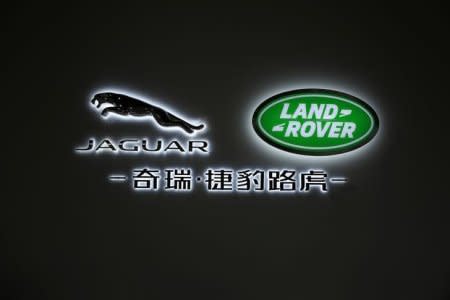 FILE PHOTO - A Jaguar Land Rover logo is seen on the building inside the Chery Jaguar Land Rover plant in Changshu, Jiangsu province, October 21, 2014. REUTERS/Aly Song