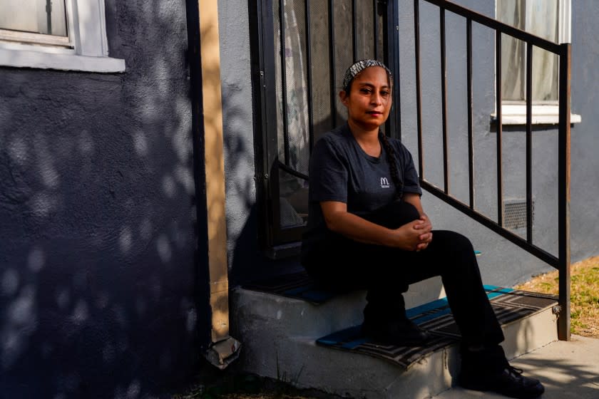 LOS ANGELES, CA - JULY 30: Lizett Aguilar poses for a portrait outside of her home in East Los Angeles on Thursday, July 30, 2020 in Los Angeles, CA. Aguilar said that after she helped lead strikes at a Domino's in Boyle Heights over unsafe working conditions, her supervisor retaliated against her by making her job more onerous. (Kent Nishimura / Los Angeles Times)