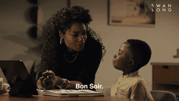 a woman saying to a boy, "Bon soir"